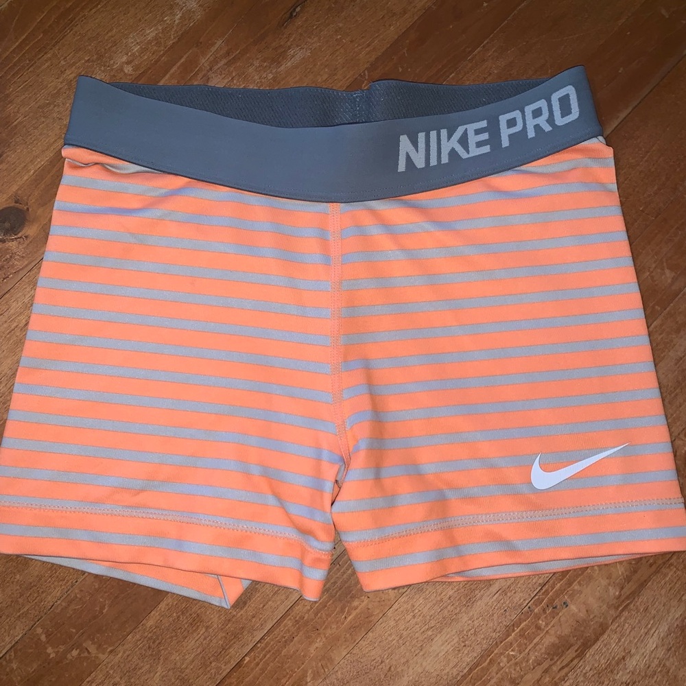 Nike Pros with orange and grey stripes! Size small
